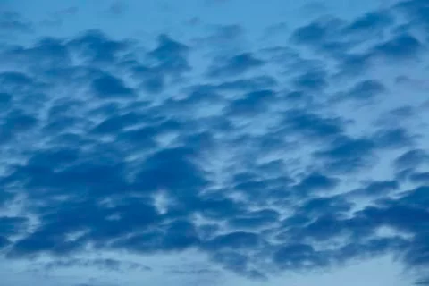 Sky - darker clouds at the blue hour Stock Photos