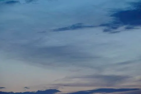 Sky - darker clouds in front of a sunset Stock Photos