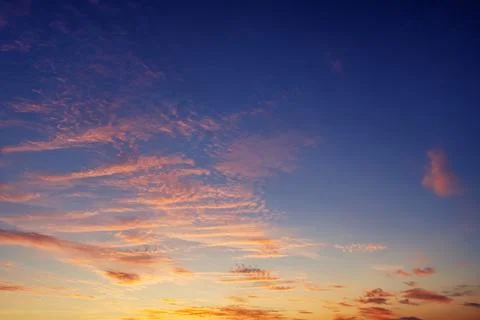 The sky before dawn, orange clouds on the background of the blue sky. Stock Photos