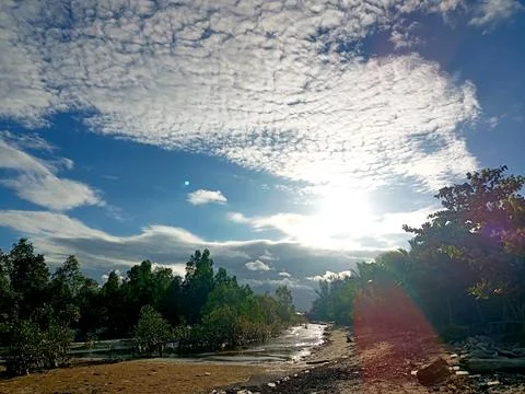 The sky is decorated with clouds. Stock Photos