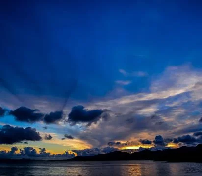 The sky is a deep blue with a few clouds Stock Photos