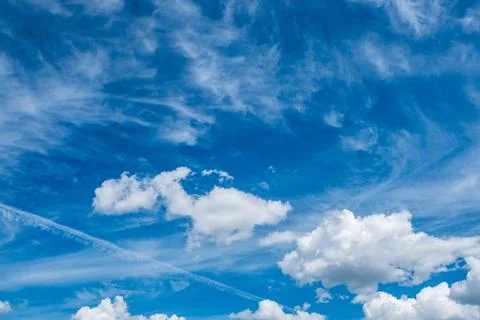 Sky with different types of cirrus and cumulus clouds Stock Photos