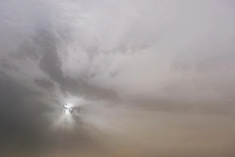 A sky, with diffused sun, clouds, colourful, Stock Photos