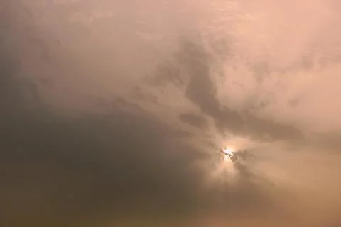 A sky, with diffused sun, clouds, colourful, Stock Photos