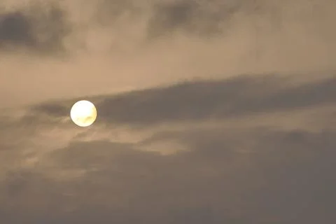 A sky, with diffused sun, clouds, colourful, Stock Photos