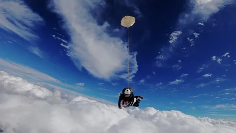 Sky dive tandem above the clouds Stock Footage 157788193