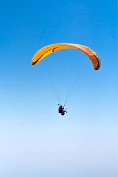 Sky Diving with space in solid blue sky Stock Photos