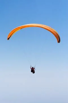 Sky Diving with space in solid blue sky Stock Photos
