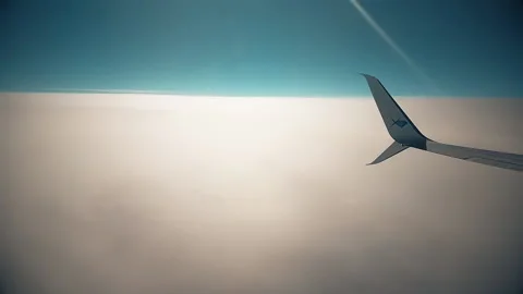 Sky during the day from the window of the plane window. Stock Footage 140936463