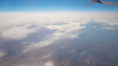 Sky during the day from the window of the plane window. Stock Footage 140938649