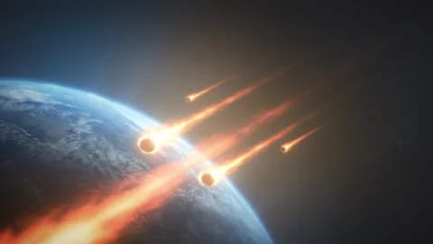 Sky erupts with blazing fireballs. Planet under threat from burning celestial Stock Footage 330039486
