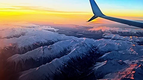 The sky is filled with clouds and the mountains are covered in snow Stock Footage 274261349