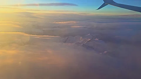 The sky is filled with clouds and the sun is setting Vidéo 270364925