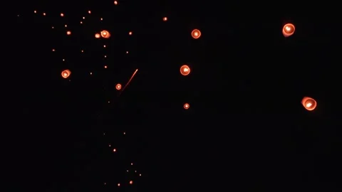 Sky Filled With Floating Lanterns and Firework Trails Stock Footage 327704449