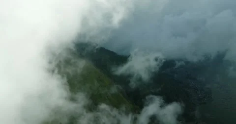 A sky filled with fluffy white cumulus clouds over a natural landscape Stock Footage 276090707
