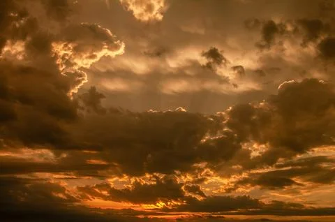 Sky on Fire: Sunset Through Dramatic Clouds Stock Photos