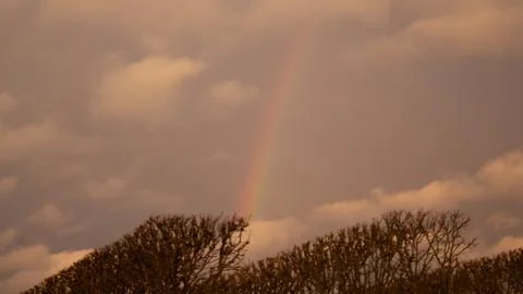 ?The sky full of clouds after the rain, the appearance of the rainbow and t.. Stock Photos