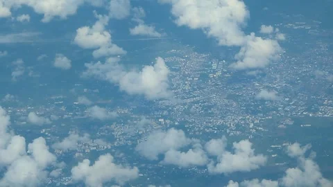 Sky Full of Clouds and Tiny City Below Seen from Airplane Window Video stock 291919076
