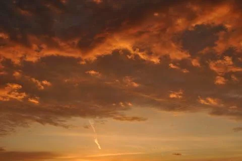 Sky full of clouds of different colors in a sunset Stock Photos