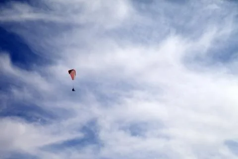 Sky gliding in cloudy sky 写真素材