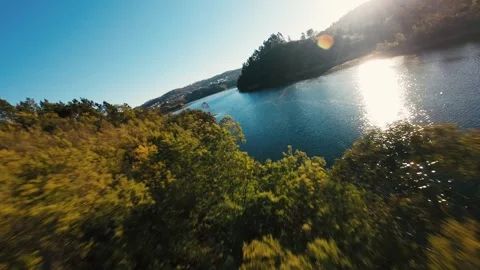 Sky glows bright above calm river waters at Castelo de Bode Stock Footage 342270732