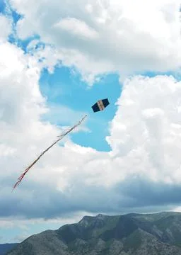 Sky with heart shape cloudscape and a flying kite Stock Photos