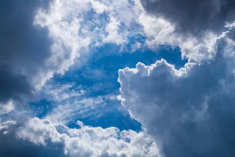 A sky with heavy, dramatic rain clouds as elements of the tropospheric climat Stock Photos