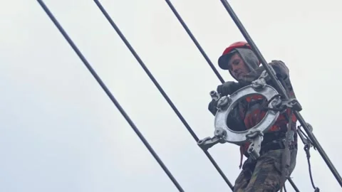 Sky-High Electrical Work Installing Voltage Separators Stock Footage 263539485