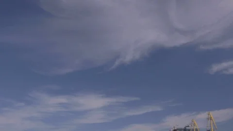 Sky landscape with clouds and some construction cranes. Video stock 126360544