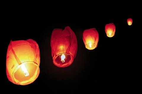 A sky lantern also known  is a small hot air balloon made of paper Stock Photos