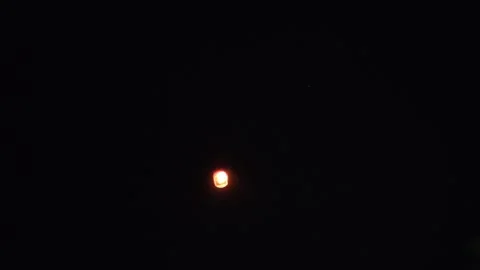 Sky lantern releasing Stock Footage 327021539