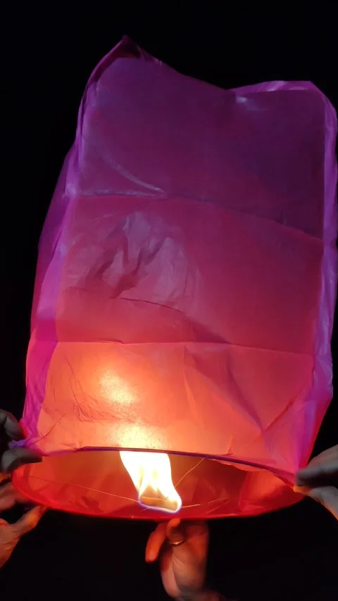 Sky lantern releasing Stock Footage 327021540