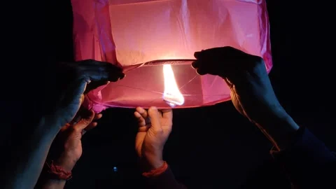 Sky lantern releasing Stock Footage 327021599