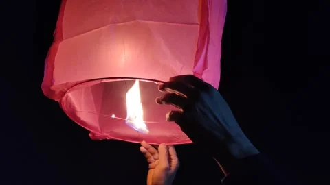 Sky lantern releasing Stock Footage 327021600
