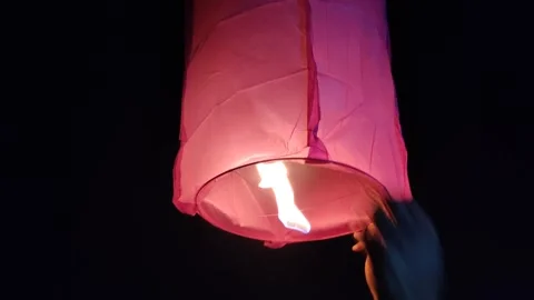 Sky lantern releasing Stock Footage 327021636