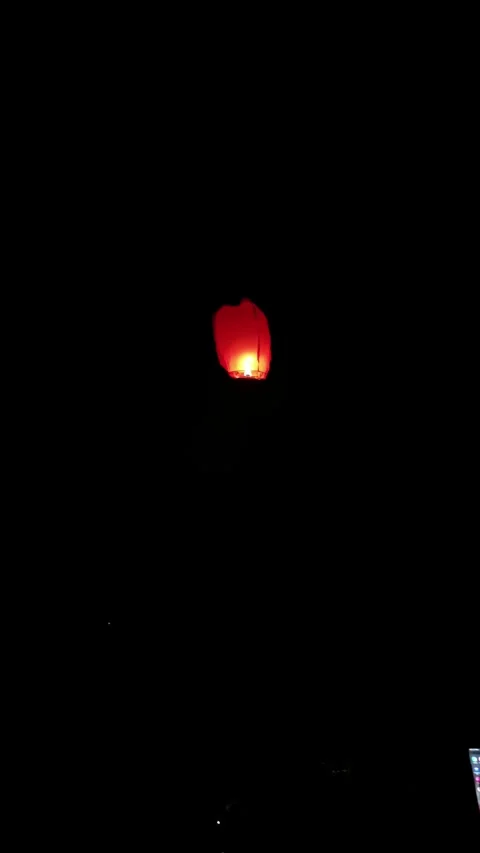 Sky Lantern Rising in Night Sky Stock Footage 340376533