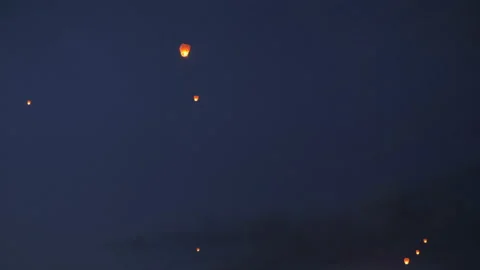 The sky lanterns fly up highly in the sky Stock Footage 136213867