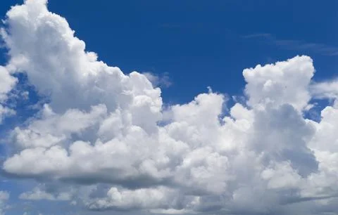 Sky with layers of clouds. Cloudscape view full of natural light. Cloud patterns Stock Photos