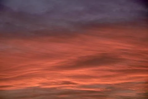 Sky light after sunset. orange background, clouds Stock Photos