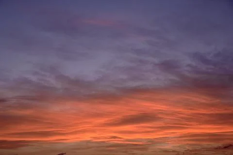 Sky light after sunset. orange background, clouds Stock Photos