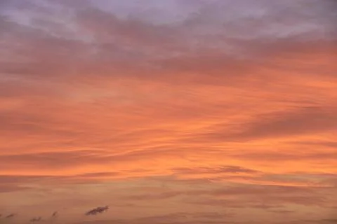 Sky light after sunset. orange background, clouds Stock Photos