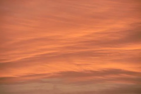 Sky light after sunset. orange background, clouds Stock Photos