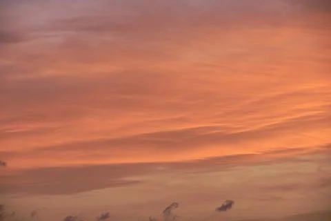 Sky light after sunset. orange background, clouds Stock Photos
