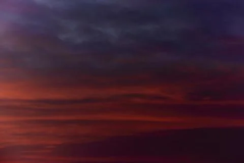 Sky light after sunset. orange background, clouds Stock Photos