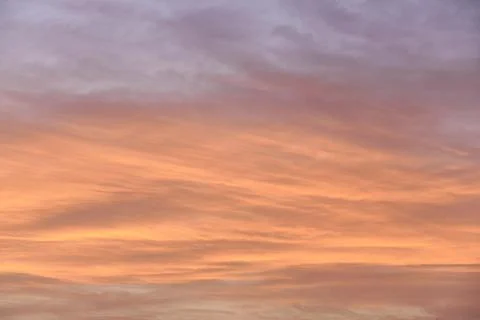 Sky light after sunset. orange background, clouds Stock Photos