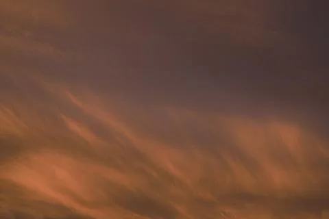 Sky light after sunset. orange background, clouds Stock Photos