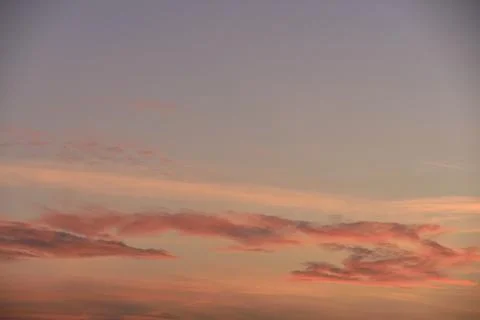 Sky light after sunset. orange background, clouds Stock Photos