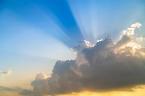 Sky with light ray and clouds at sunset, nature background. Stock Photos