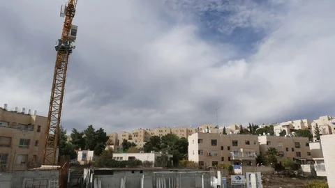 Sky with mooving clouds over construction site in Jerusalem. Timelapse. Stock Footage 84718181