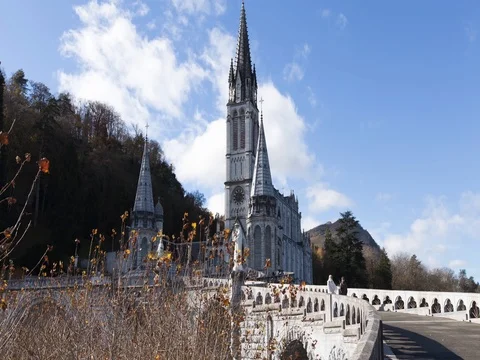 Sky motion timelapse over Lourdes cathedral Stock Footage 75263129